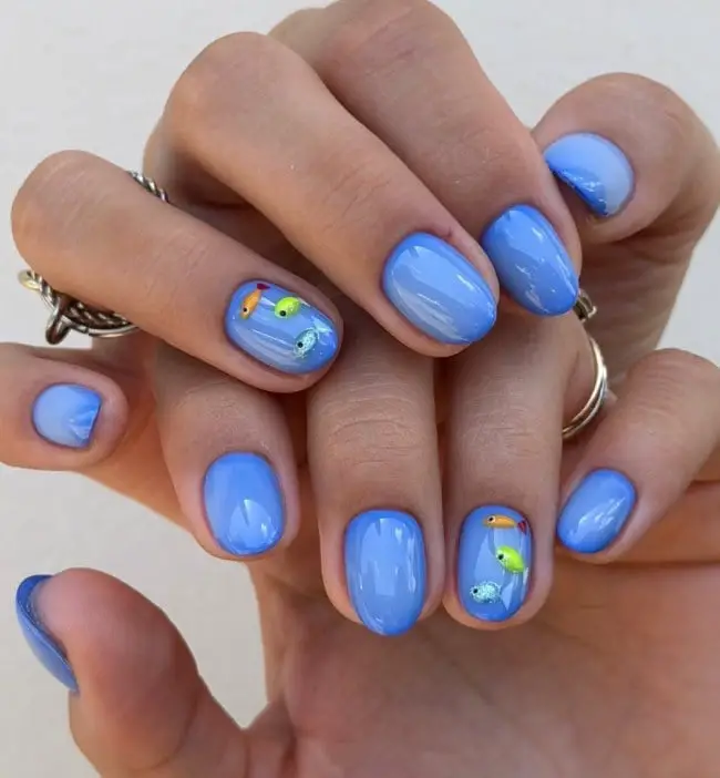 Short Oval Bright Blue Nails With Colorful Fish — Cute Blue Nails