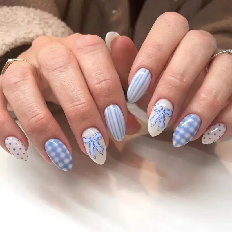 Medium Almond Nails With Blue Patterns On White — Cute Blue Nails