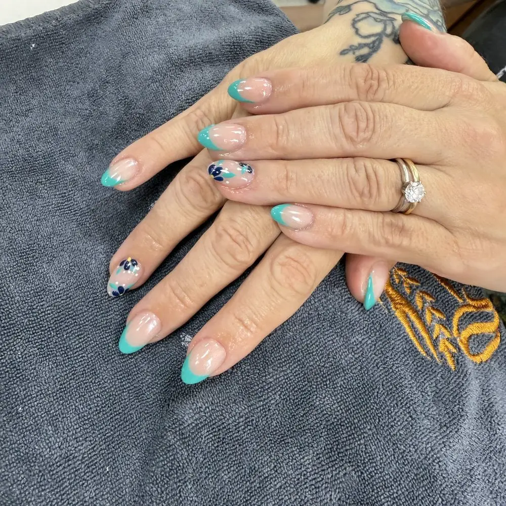 Medium Almond Nails With Teal French Tips and Floral Decals — Cute Gel X Nails
