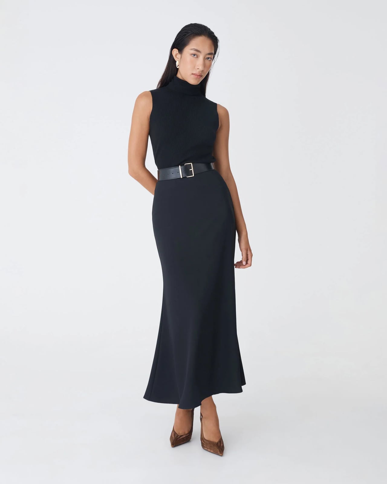 Sleeveless Turtleneck With Flared Black Maxi Skirt — Elegant Black Maxi Skirt Outfit