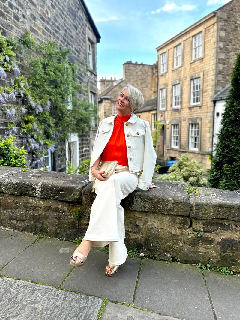 Orange High-Neck Top and Cropped White Jacket — Elegant Hot Weather Outfits