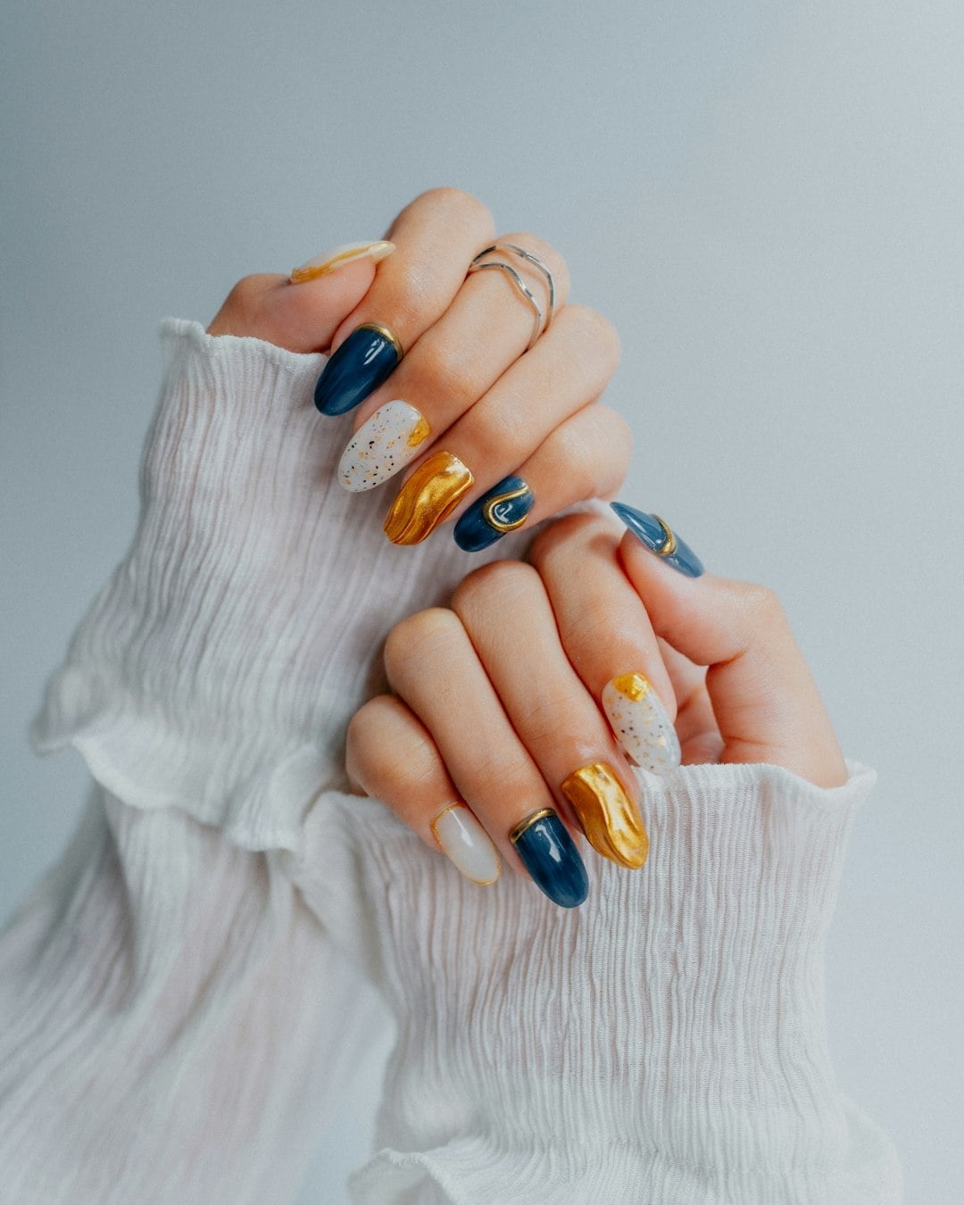 Navy Blue Gold Foil Abstract Medium Almond Nails Navy Blue Gold Foil Abstract Medium Almond Nails — Nail Art Ideas