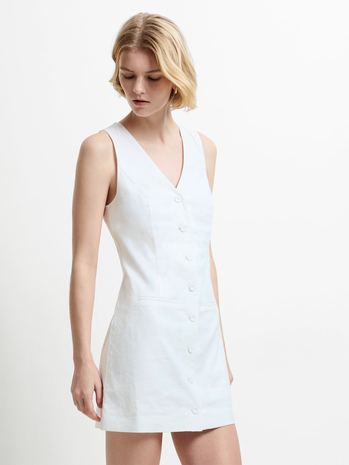 White Sleeveless A-line Mini Dress With Button Front, Close-Up Take — Simple a Line Dresses
