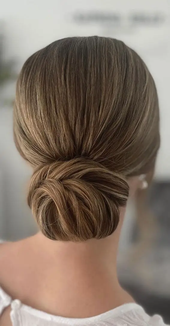Sleek Low Bun With Subtle Highlights Sleek Low Bun With Subtle Highlights — Simple Back Haircuts