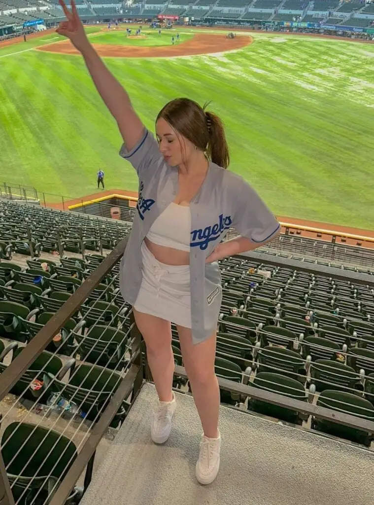 Gray Baseball Jersey Over White Crop Top with Mini Skirt Gray Baseball Jersey Over White Crop Top with Mini Skirt — Simple Baseball Game Outfits