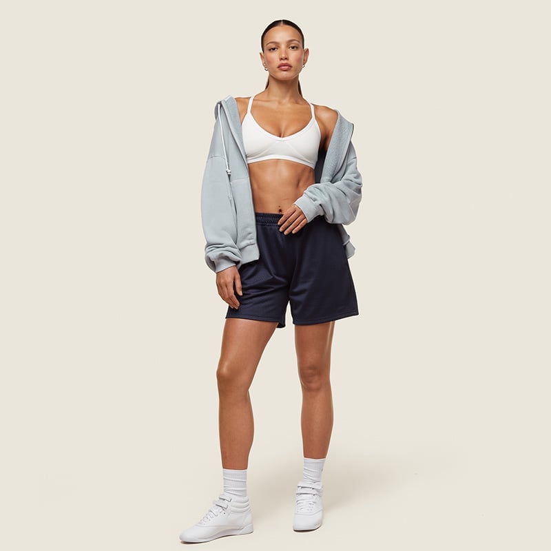 Zip-up Hoodie Over Sports Bra with Mesh Shorts Zip-up Hoodie Over Sports Bra with Mesh Shorts — Simple Basketball Game Outfits