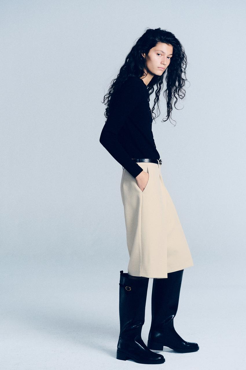 Beige Culottes and Long Sleeve Top with Knee-High Boots Beige Culottes and Long Sleeve Top with Knee-High Boots — Simple Black Boots Outfit