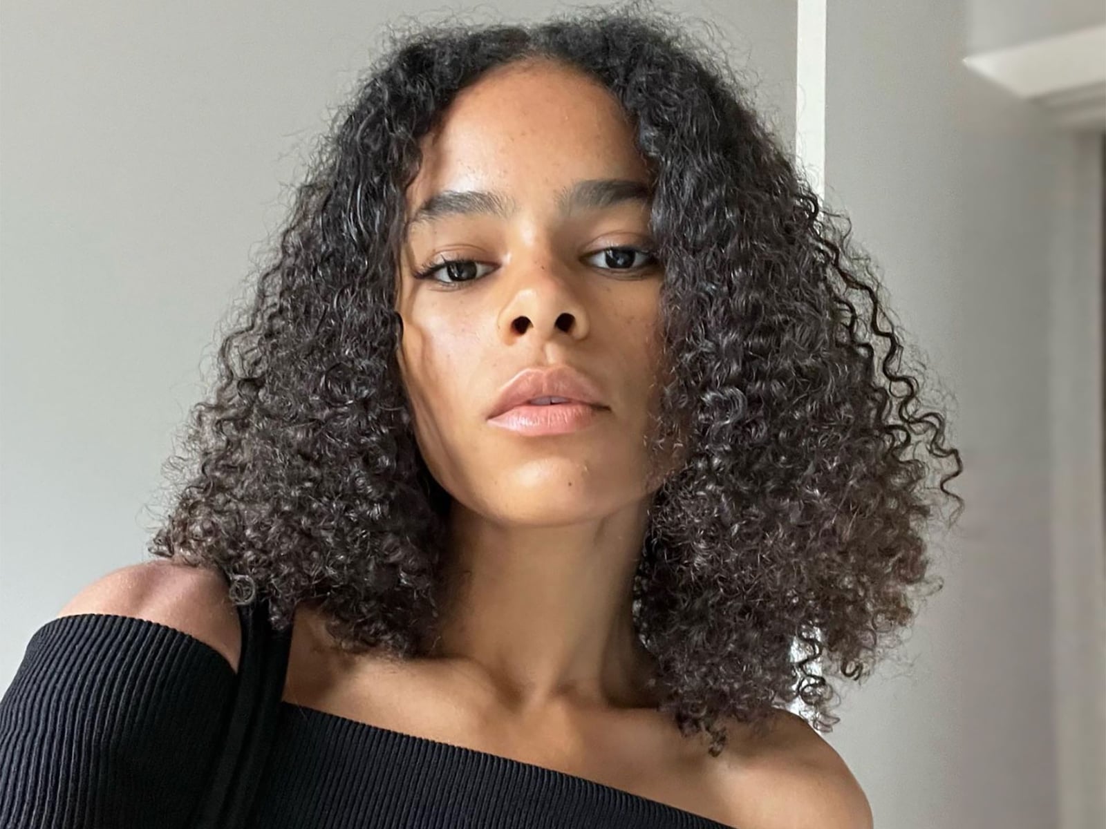 Chin Length Bob With Defined Curls And Short Bangs Chin Length Bob With Defined Curls And Short Bangs — Simple Bob with Curls