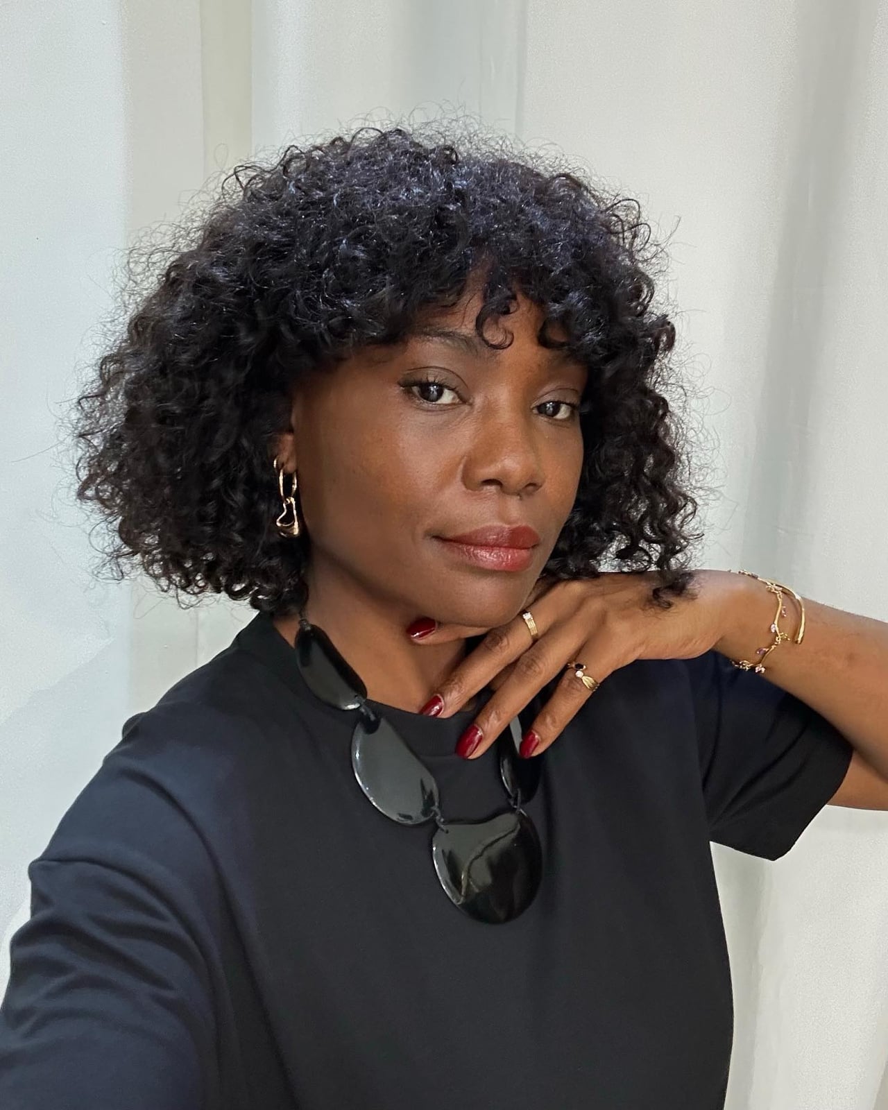 Black Bob With Defined Curls And Full Bangs Black Bob With Defined Curls And Full Bangs — Simple Bob with Curls