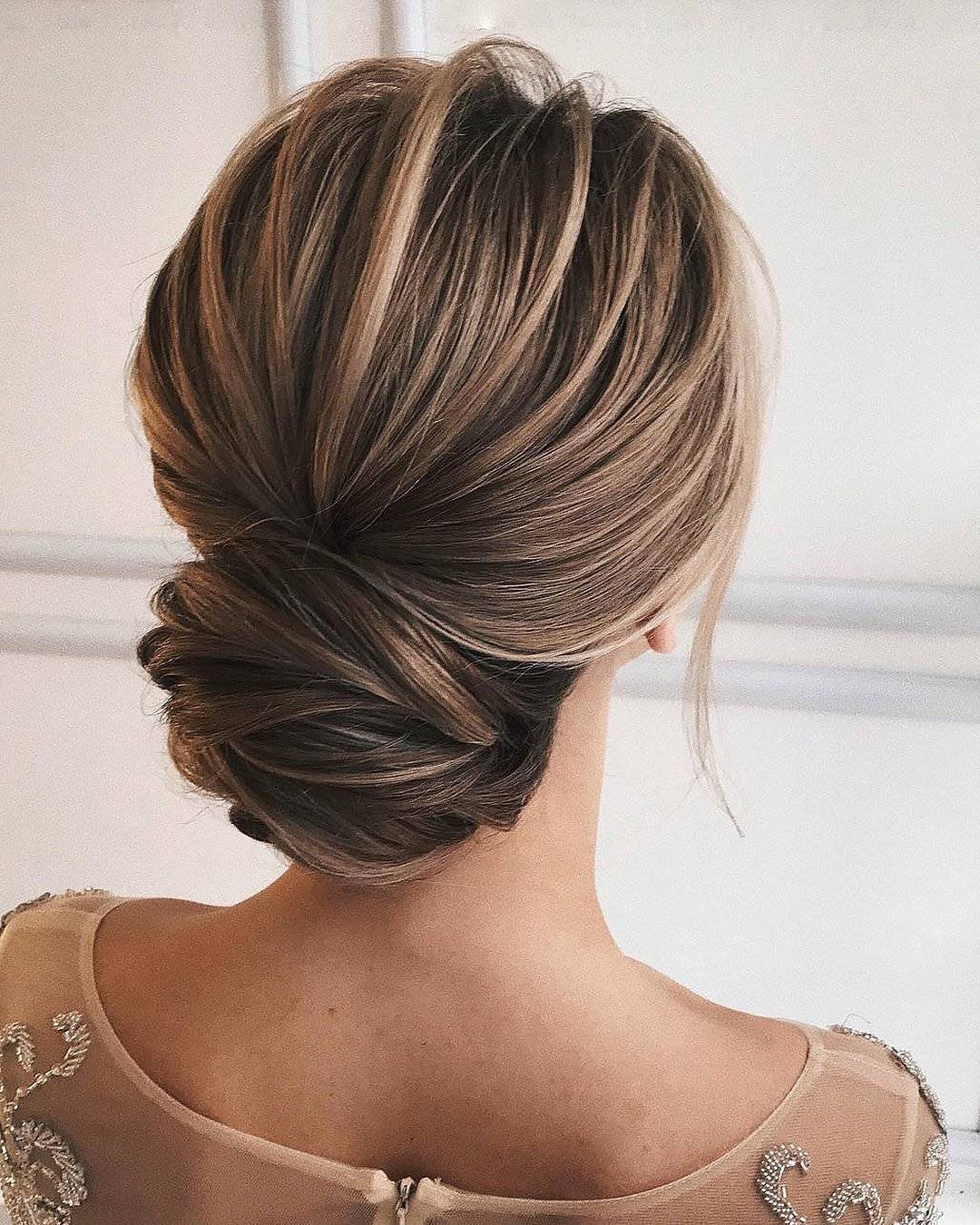 Sophisticated Low Bun With Intricate Twists Sophisticated Low Bun With Intricate Twists — Simple Bridesmaid Updos