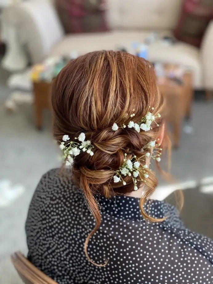 Twisted Low Bun With Braids and Flowers Twisted Low Bun With Braids and Flowers — Simple Bridesmaid Updos
