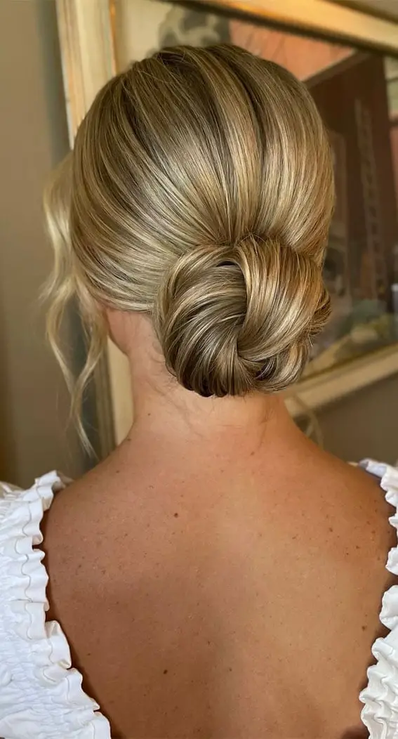 Sleek Low Bun With Middle Parting Sleek Low Bun With Middle Parting — Simple Bridesmaid Updos