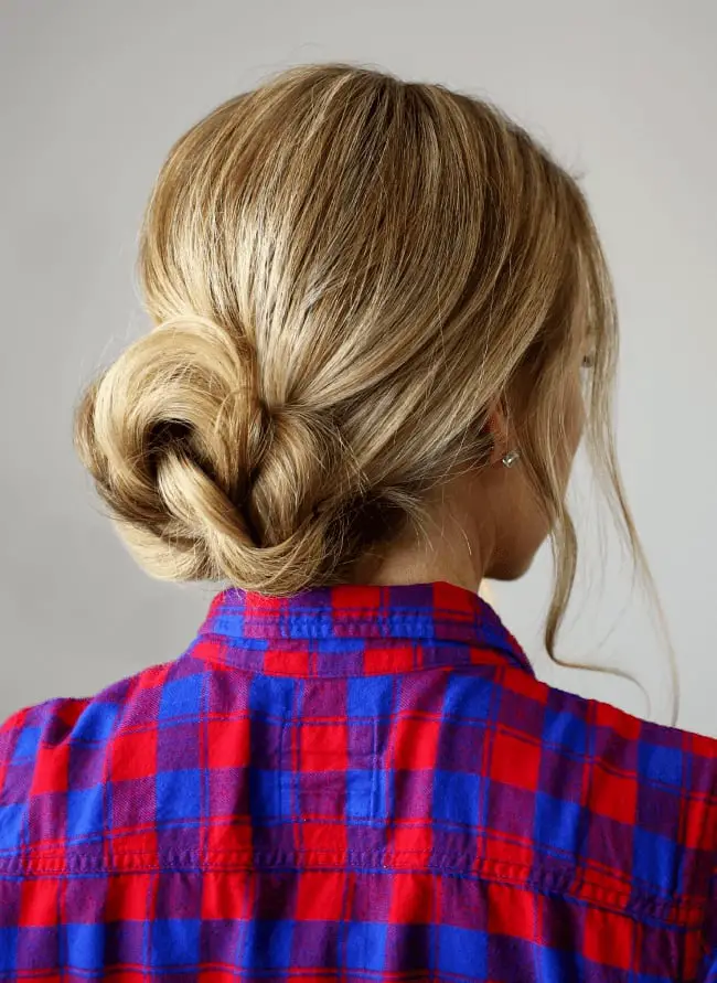 Blonde Twisted Braided Bun With Loose Strands Blonde Twisted Braided Bun With Loose Strands — Simple Bun Braids