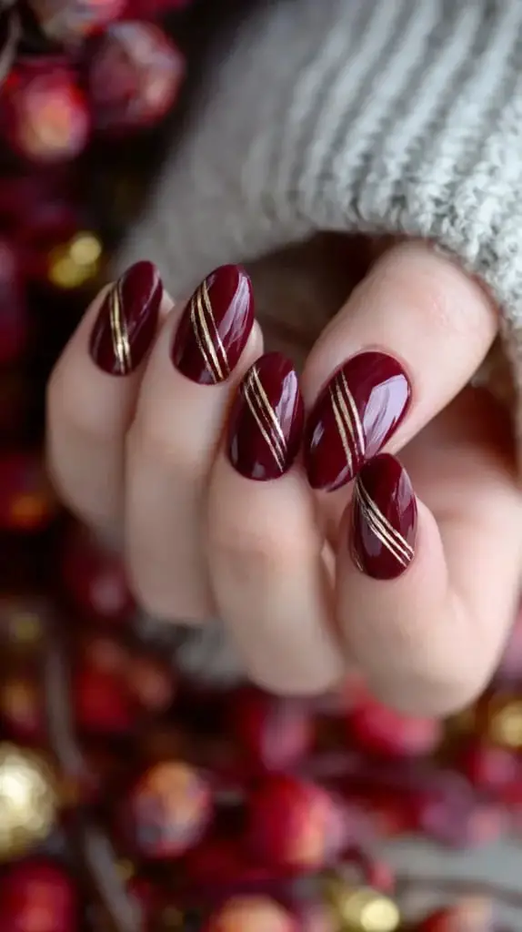 Oval Burgundy With Gold Stripes — Simple Burgundy Nails Art