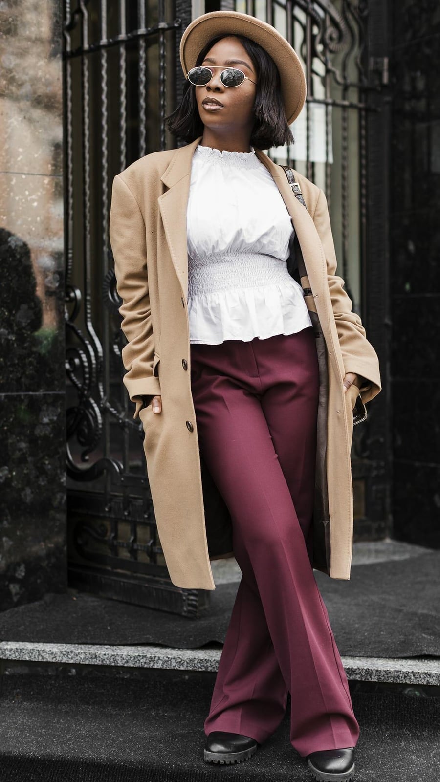 Burgundy Wide-Leg Trousers with a White Ruffled Blouse and Camel Coat Burgundy Wide-Leg Trousers with a White Ruffled Blouse and Camel Coat — Simple Burgundy Pants Outfits