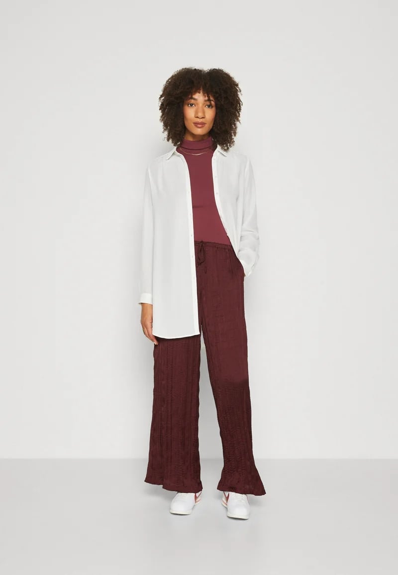Textured Burgundy Wide-Leg Trousers with an Oversized, Close-Up Take Textured Burgundy Wide-Leg Trousers with an Oversized, Close-Up Take — Simple Burgundy Pants Outfits