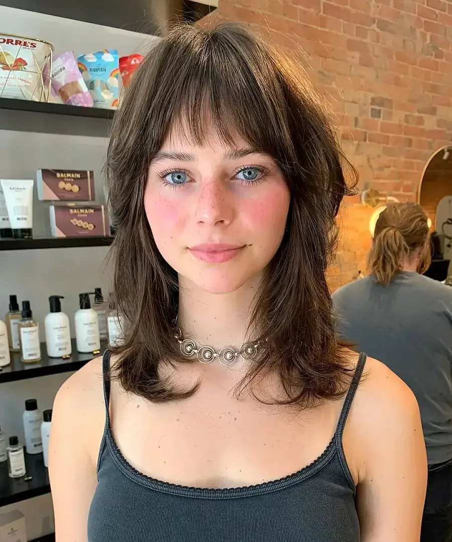 Medium Brown Butterfly With Wispy Bangs Medium Brown Butterfly With Wispy Bangs — Simple Butterfly Haircut