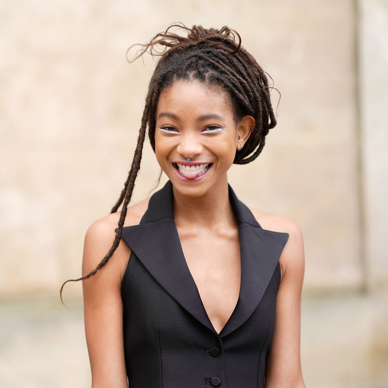 Mid-Back Coily Locs High Bun With Loose Tendrils — Simple Color Locs