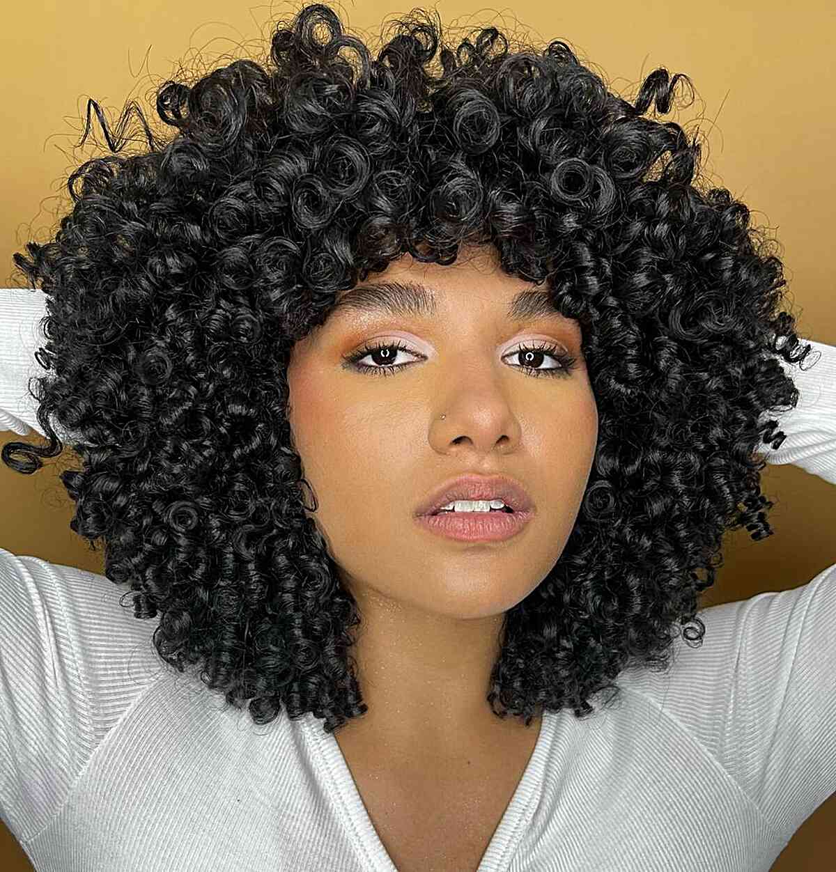 Mid-Back Voluminous Curls With Auburn Undertones Mid-Back Voluminous Curls With Auburn Undertones — Simple Curly Bangs
