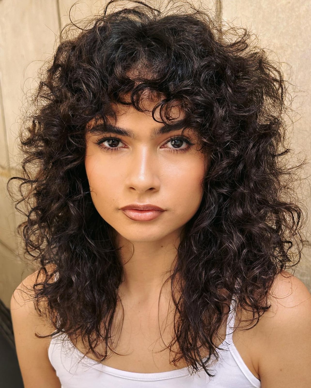 Shoulder Length Shag With Full Volume Shoulder Length Shag With Full Volume — Simple Curly Bangs