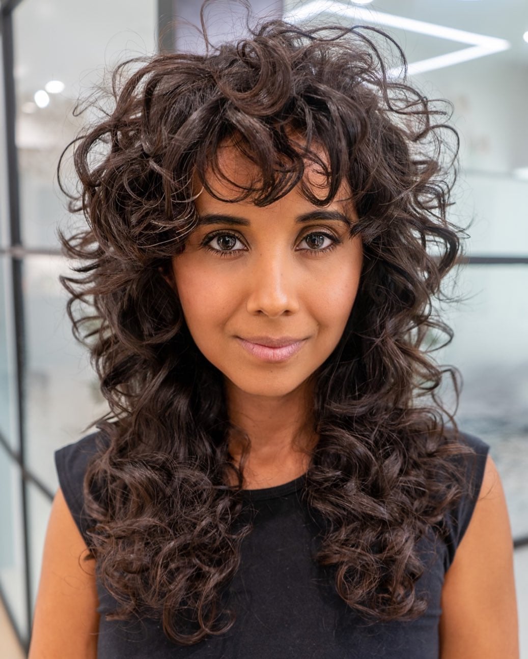 Shoulder Shag With Curly Curtain Bangs Shoulder Shag With Curly Curtain Bangs — Simple Curly Bangs