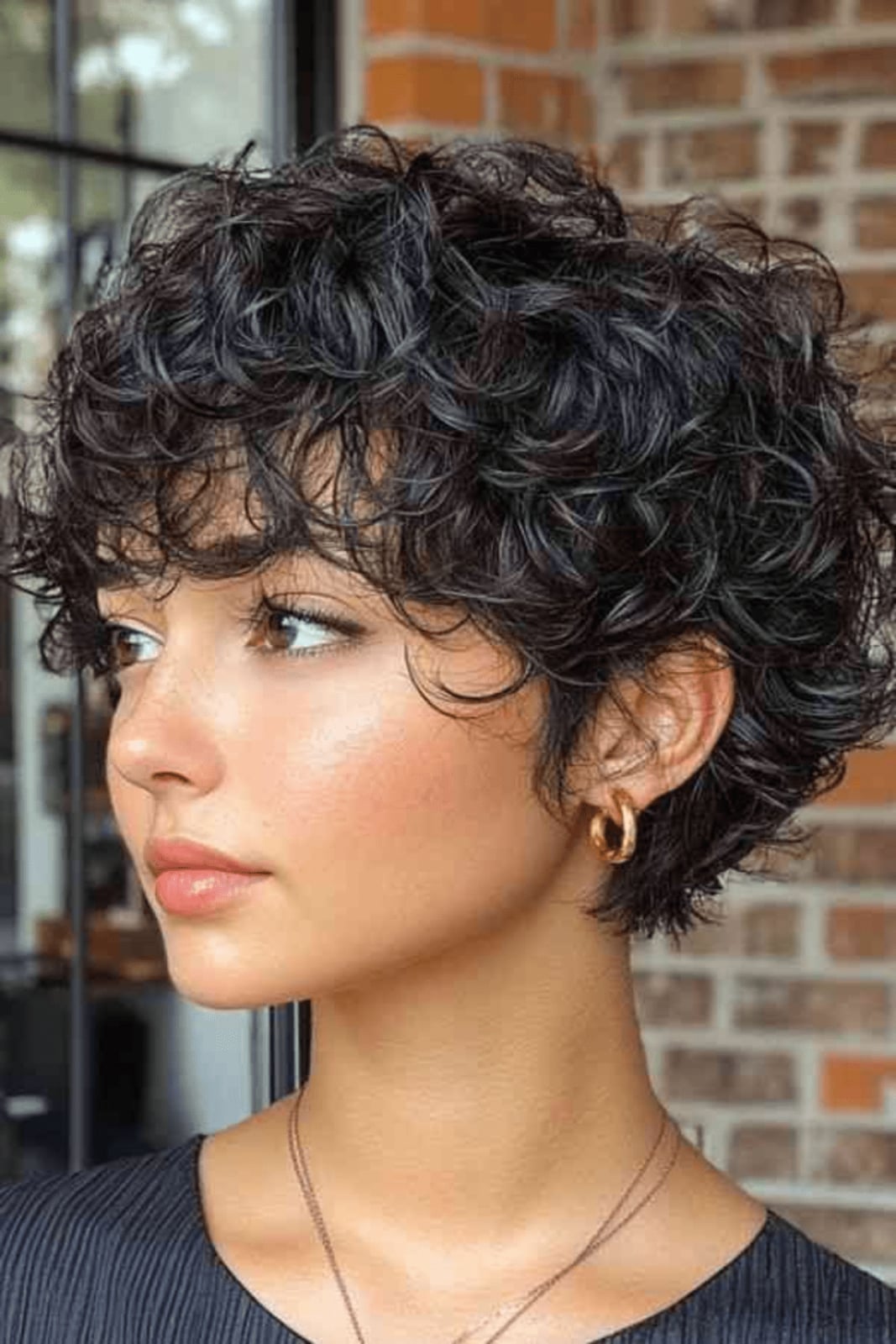 Short Pixie With Textured Curly Bangs Short Pixie With Textured Curly Bangs — Simple Curly Hair Cuts