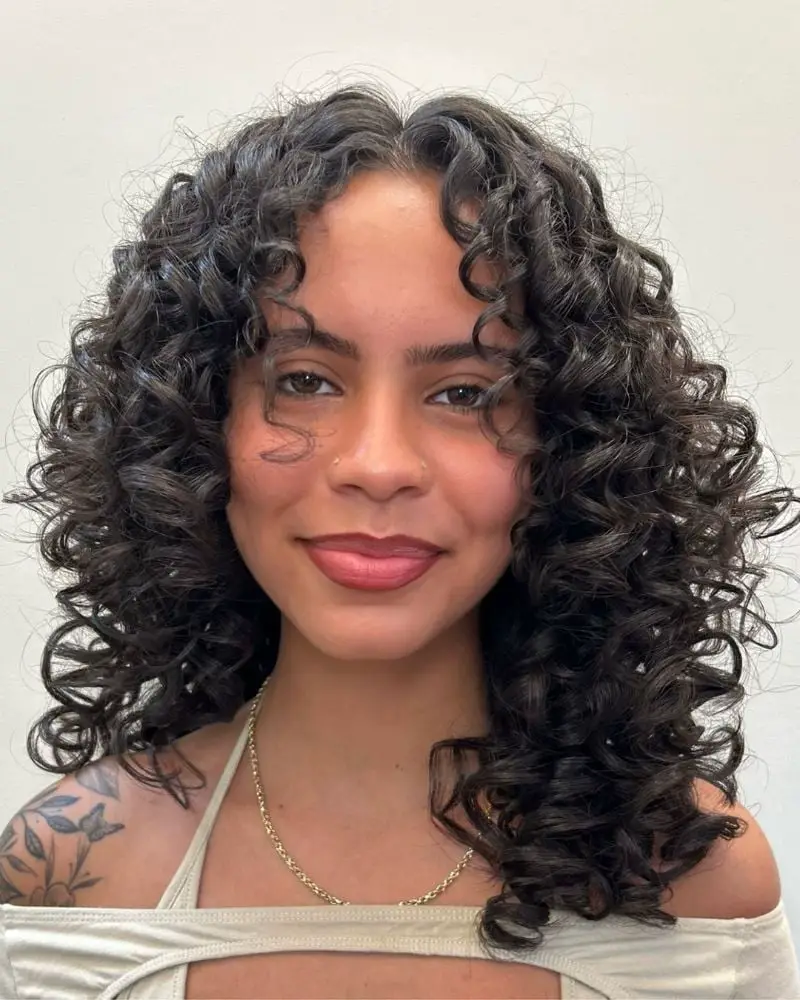 Collarbone Layered Shag With Wispy Bangs Collarbone Layered Shag With Wispy Bangs — Simple Curly Hair Layers