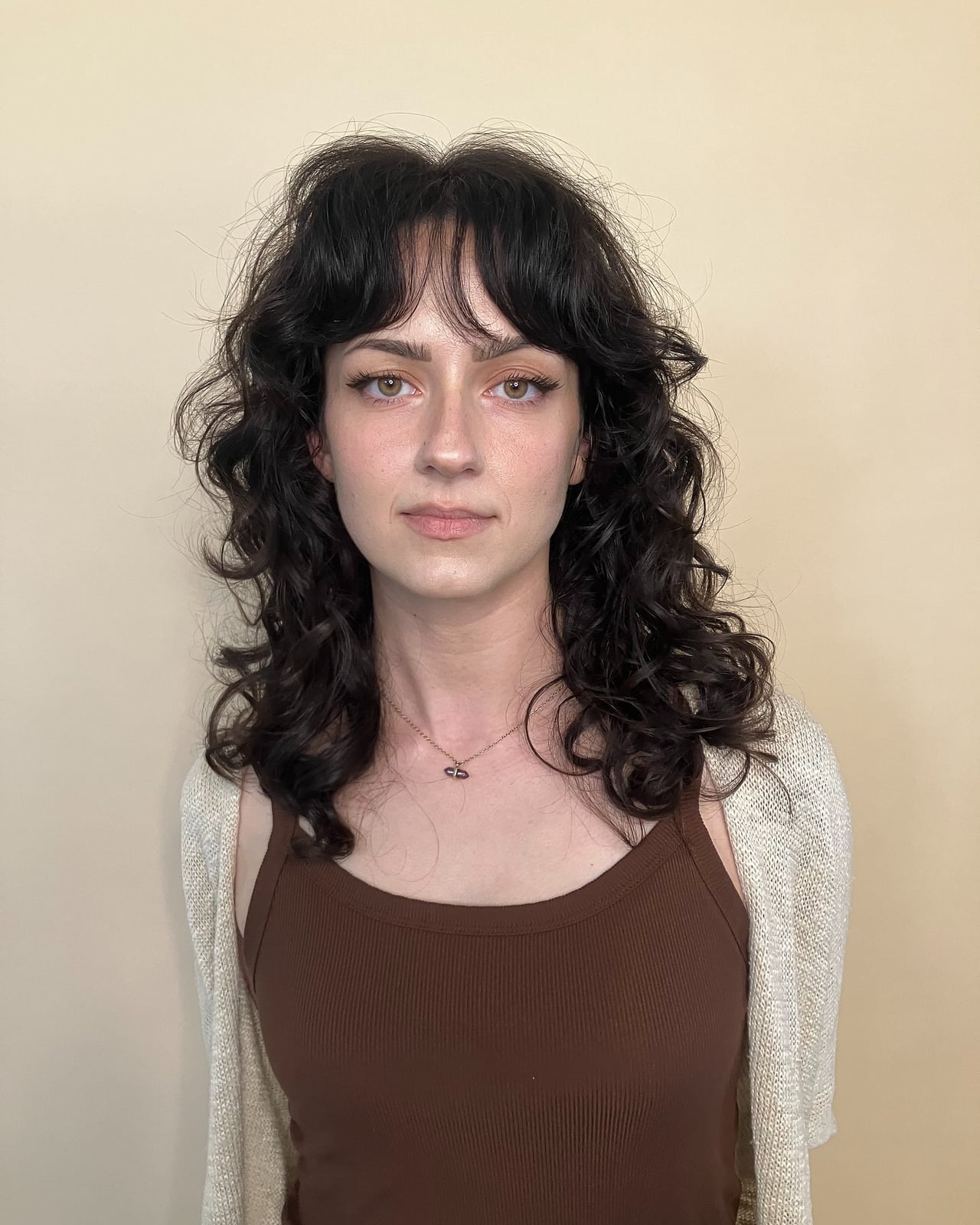 Medium Length Dark Brown Shag With Curtain Bangs and Glossy Texture — Simple Curly Shag