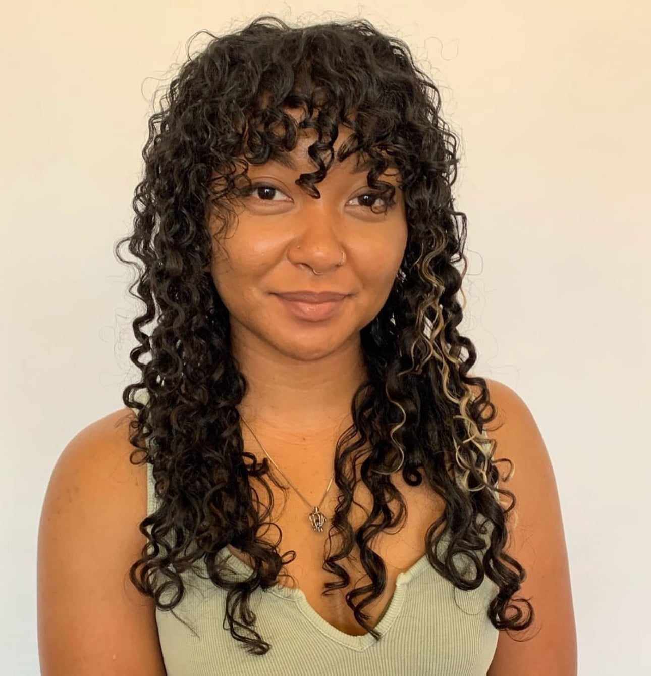 Mid-Back Shag With Blonde Highlights — Simple Curly Shag
