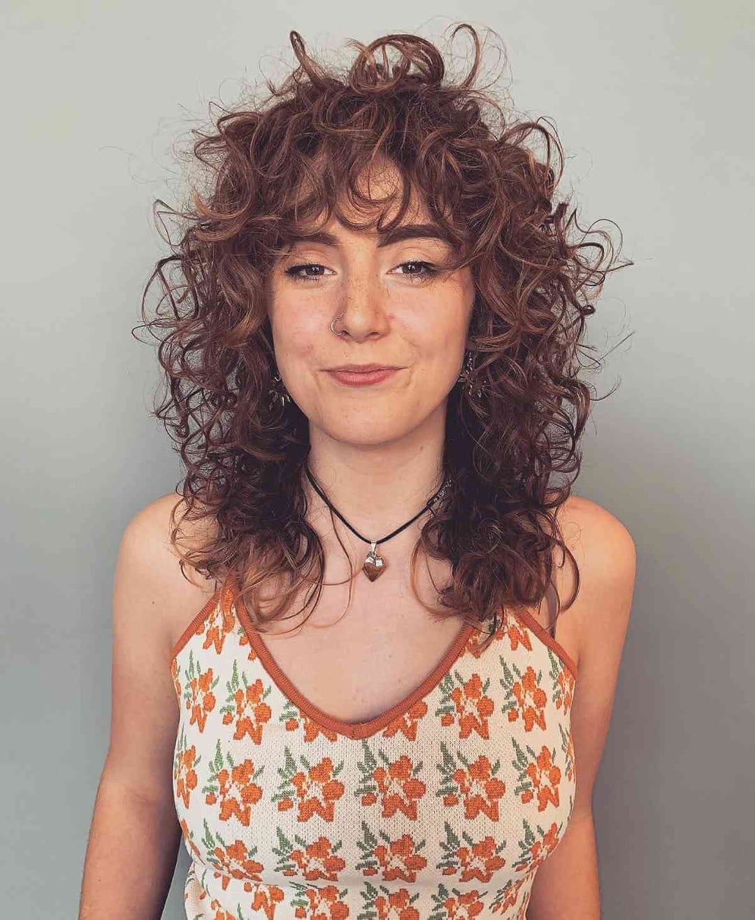 Collarbone Shag With Full Curly Bangs and Copper Tones — Simple Curly Shag Haircut