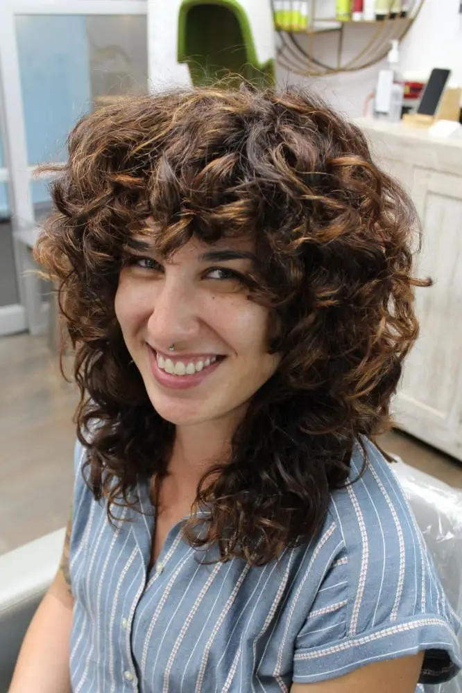 Collarbone Dark Brown Wolf Cut With Voluminous Curls Collarbone Dark Brown Wolf Cut With Voluminous Curls — Simple Curly Wolf Cut