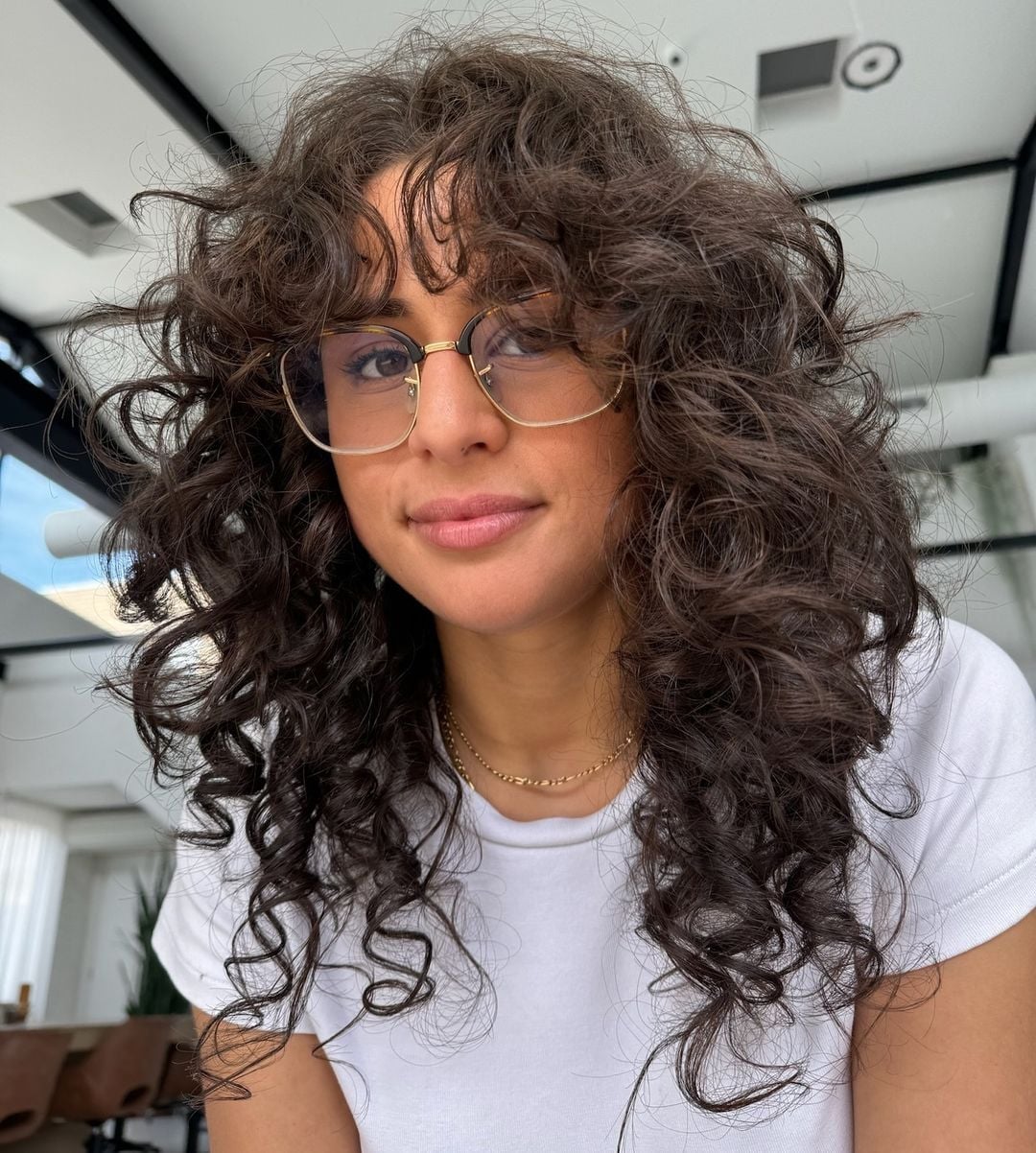 Collarbone Dark Brown Wolf Cut With Face-Framing Bangs Collarbone Dark Brown Wolf Cut With Face-Framing Bangs — Simple Curly Wolf Cut