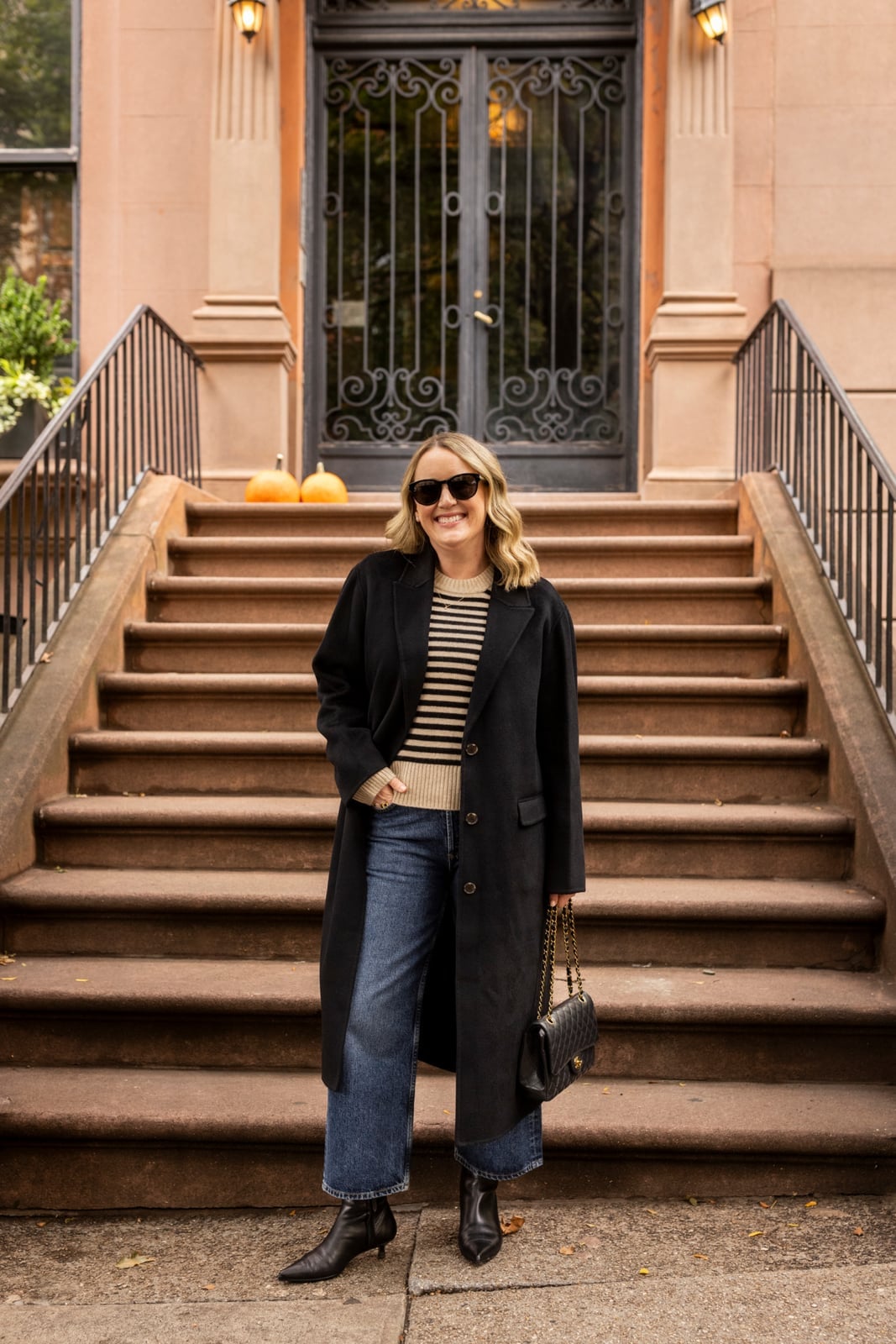 Long Black Coat Over Striped Sweater and Jeans for Dinner — Simple Dinner Outfits Night