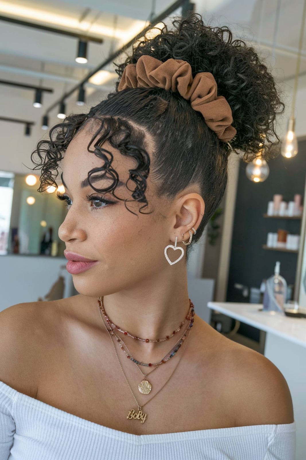 High Bun With Wispy Bangs And Defined Curls — Simple Edges Hairstyles