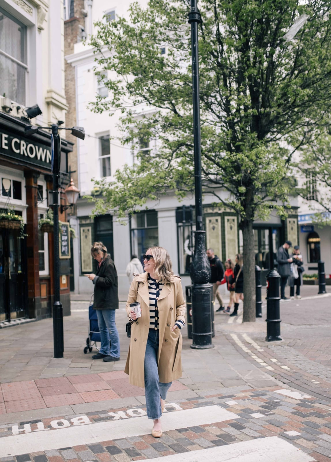 Beige Trench Coat Over Striped Top with Jeans — Simple Game Day Outfits