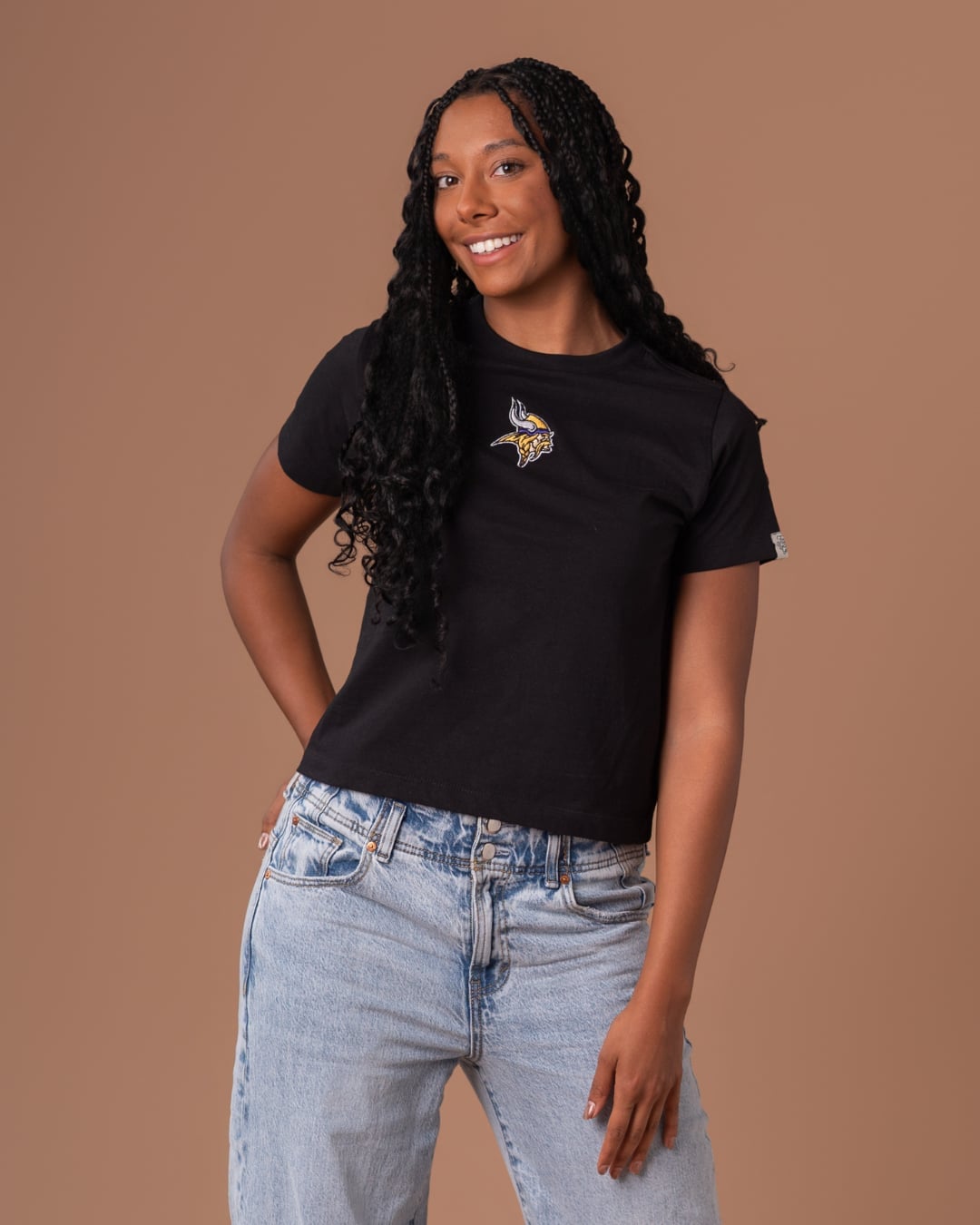 Black T-Shirt with Team Logo and Light Blue Jeans — Simple Game Day Outfits