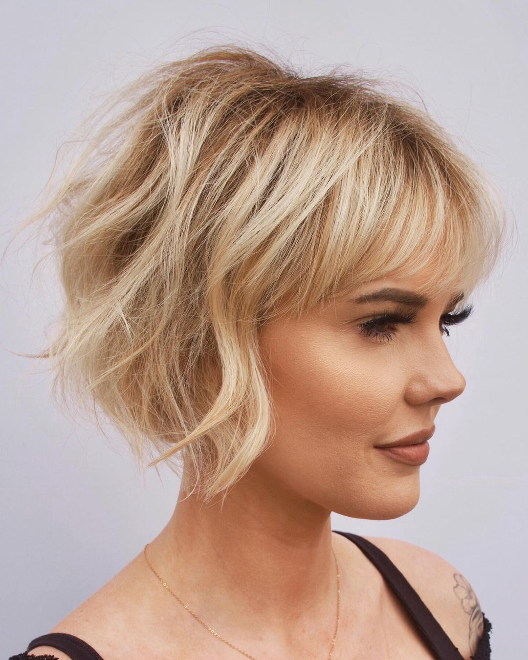 Chin Length Textured Bob With Blunt Bangs — Simple Haircuts for Fine Hair