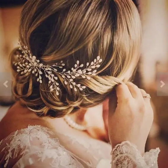 Low Bun With Soft Waves And Accessory — Simple Hairstyles for Wedding