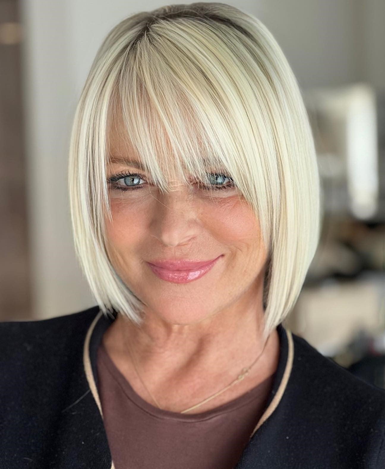 Sleek Platinum Bob With Blunt Bangs — Simple Hairstyles for Women over 60