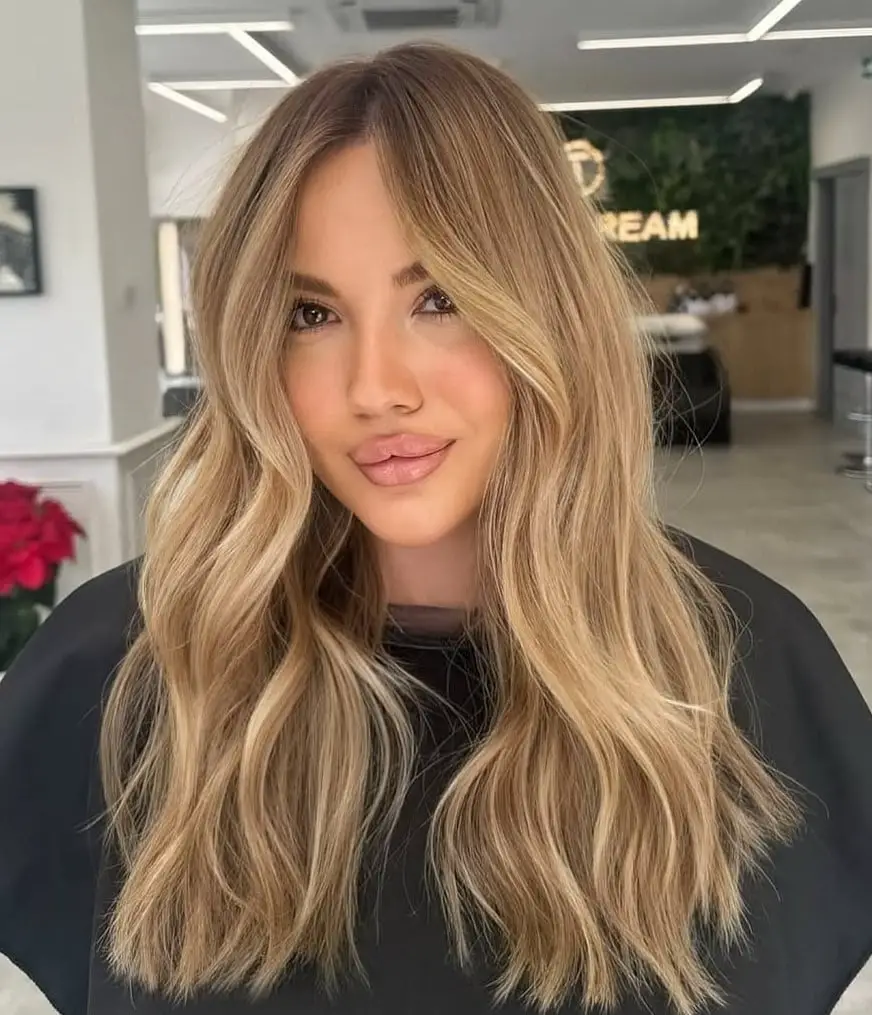Mid-Back Wavy Blonde With Lighter Highlights — Simple Highlights on Blonde