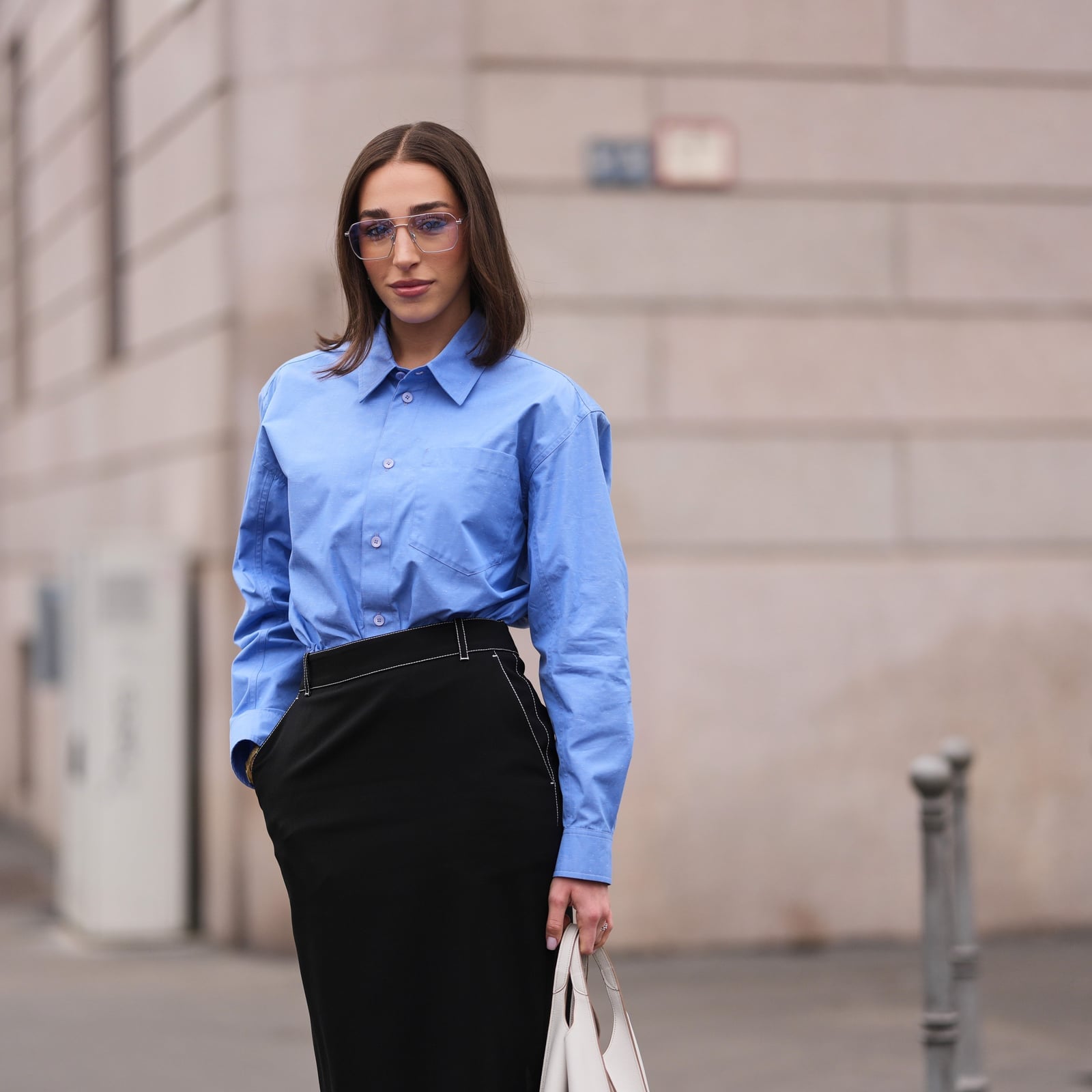 Blue Button-Down Shirt with Black Pencil Skirt and Tote Bag Blue Button-Down Shirt with Black Pencil Skirt and Tote Bag — Simple Job Interview Outfits