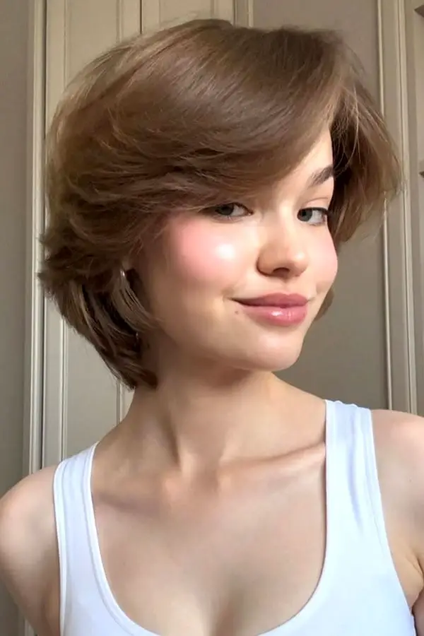 Chin Length Bob With Voluminous Side Swept Bangs Chin Length Bob With Voluminous Side Swept Bangs — Simple Layered Bob Hairstyles