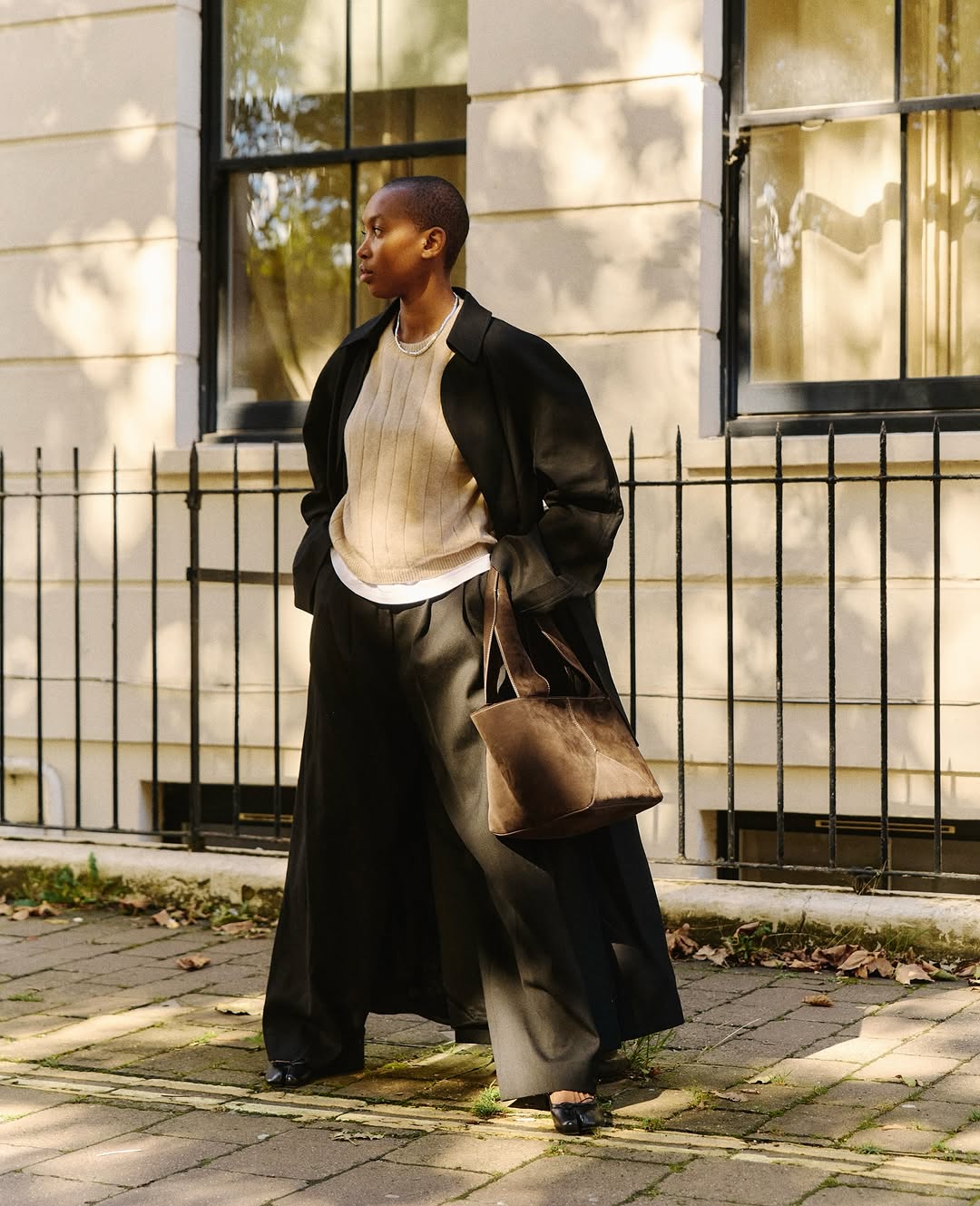 Black Coat Over Striped Sweater And T-Shirt Black Coat Over Striped Sweater And T-Shirt — Simple Layered Ideas