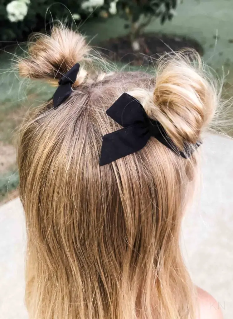 Shoulder Length Messy Buns With Black Bows Shoulder Length Messy Buns With Black Bows — Simple Little Girl Hairstyles