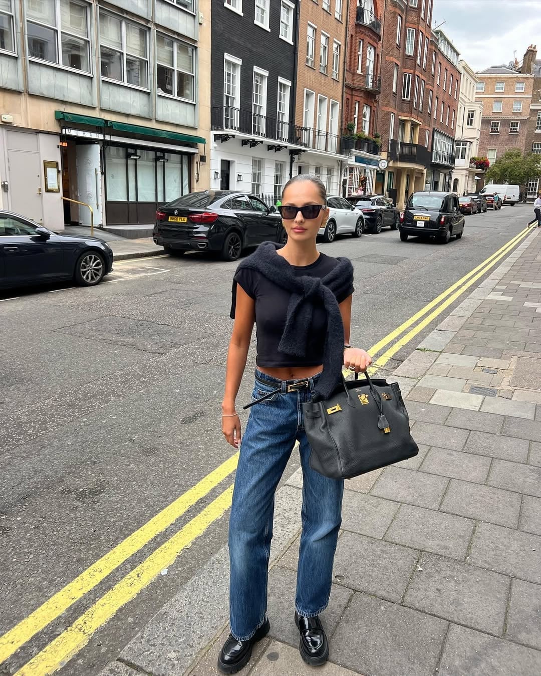 Chunky Black Loafers with Relaxed Jeans and Draped, Close-Up Take — Simple Loafer Outfits