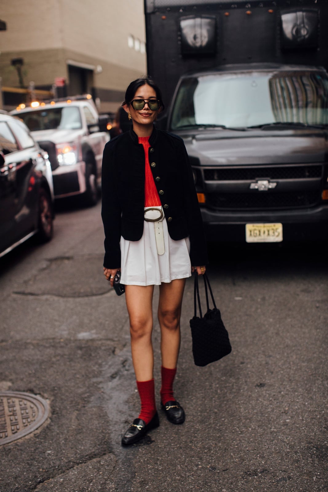 Black Horsebit Loafers with Mini Skirt and Red Top — Simple Loafer Outfits