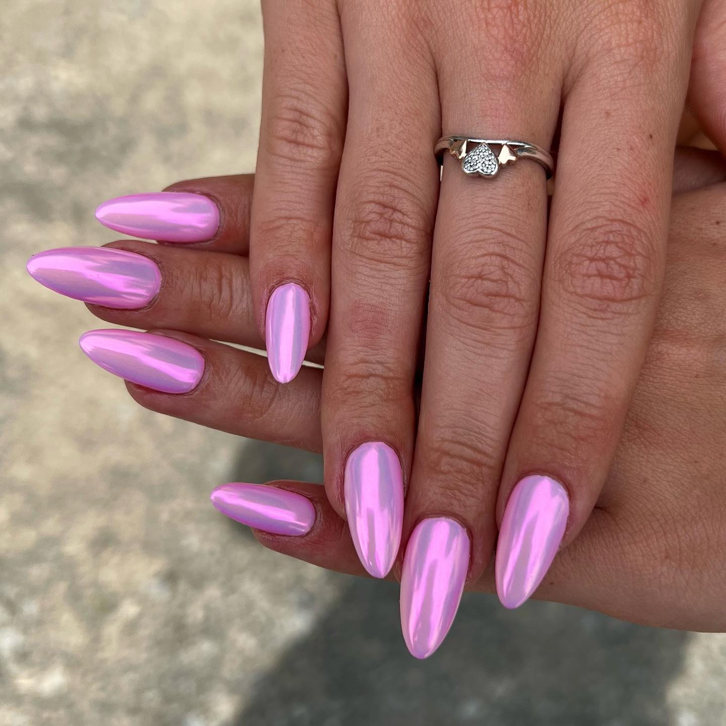 Reflective Pale Pink Chrome Long Stiletto With Against An Outdoor Reflective Pale Pink Chrome Long Stiletto With Against An Outdoor — Simple Metallic Nails