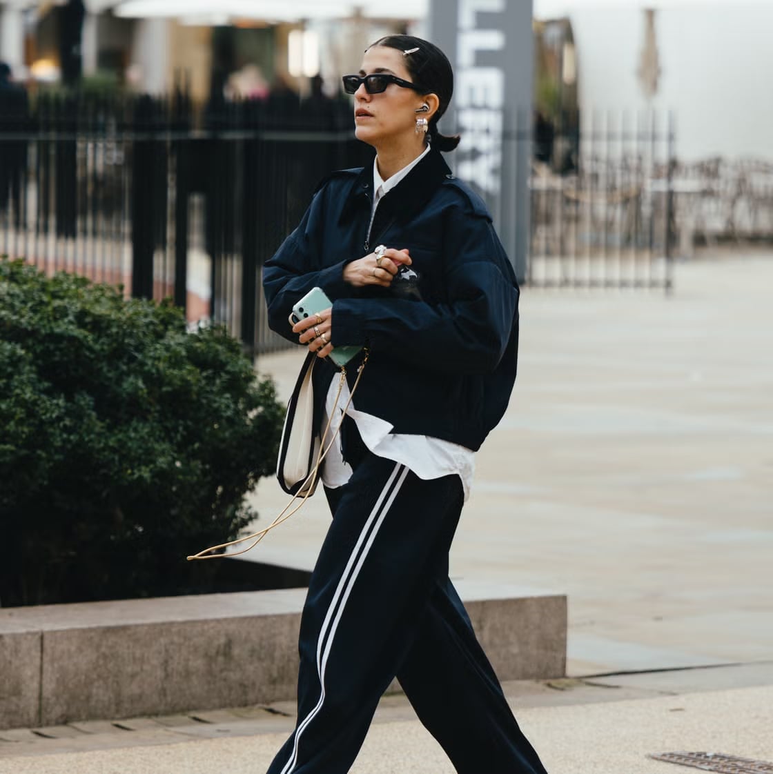 Navy Track Pants With a White Button-Down Shirt, Close-Up Take Navy Track Pants With a White Button-Down Shirt, Close-Up Take — Simple Navy Blue Pants Outfits