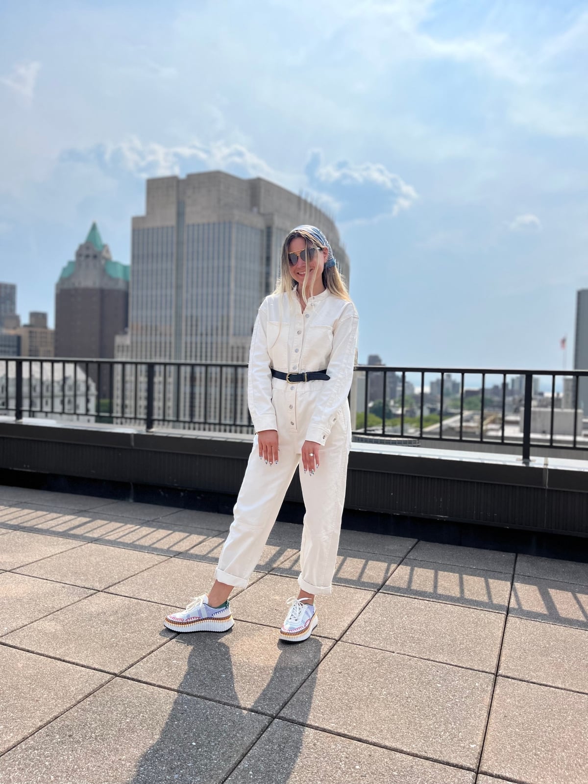 White Denim Jumpsuit with Multi-Colored Sneakers — Simple New Balance Outfits