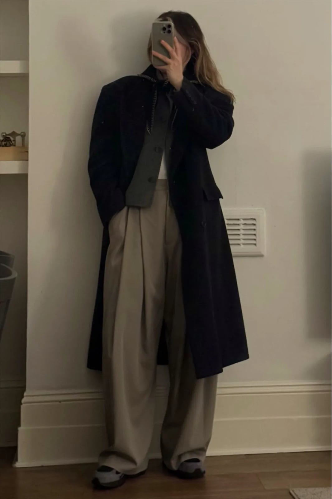 Long Black Overcoat with Pleated Beige Trousers — Simple New Balance Outfits